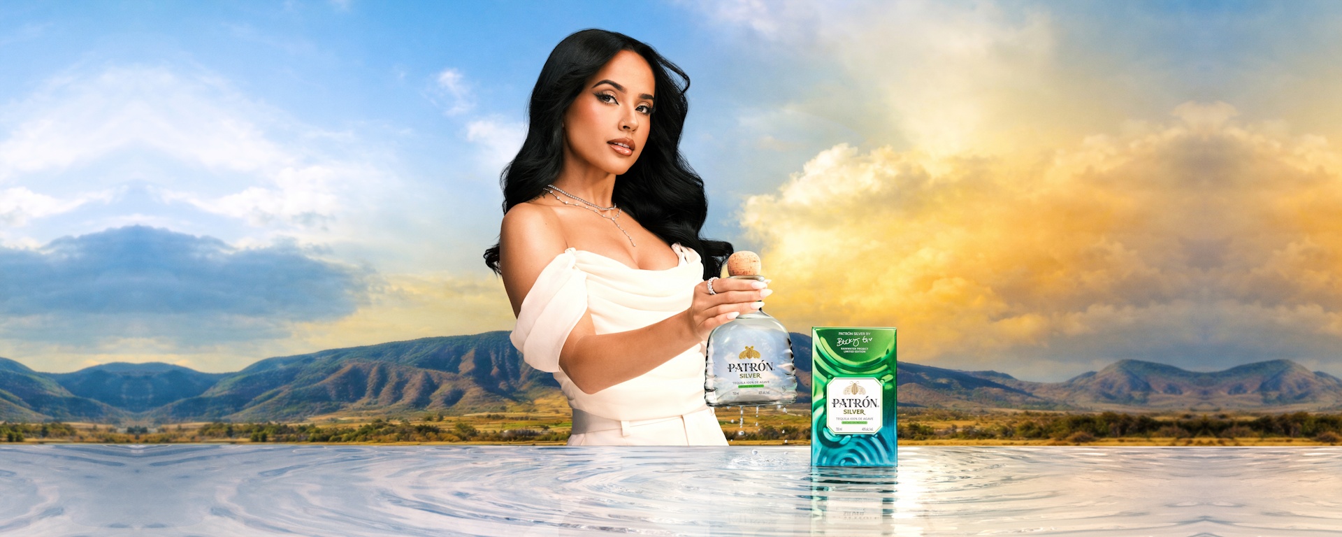 Becky G with limited-edition PATRÓN Silver tequila bottle and Isla Urbana gift tin from the PATRÓN Rainwater Collection
