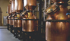 Multiple copper pots in a factory.